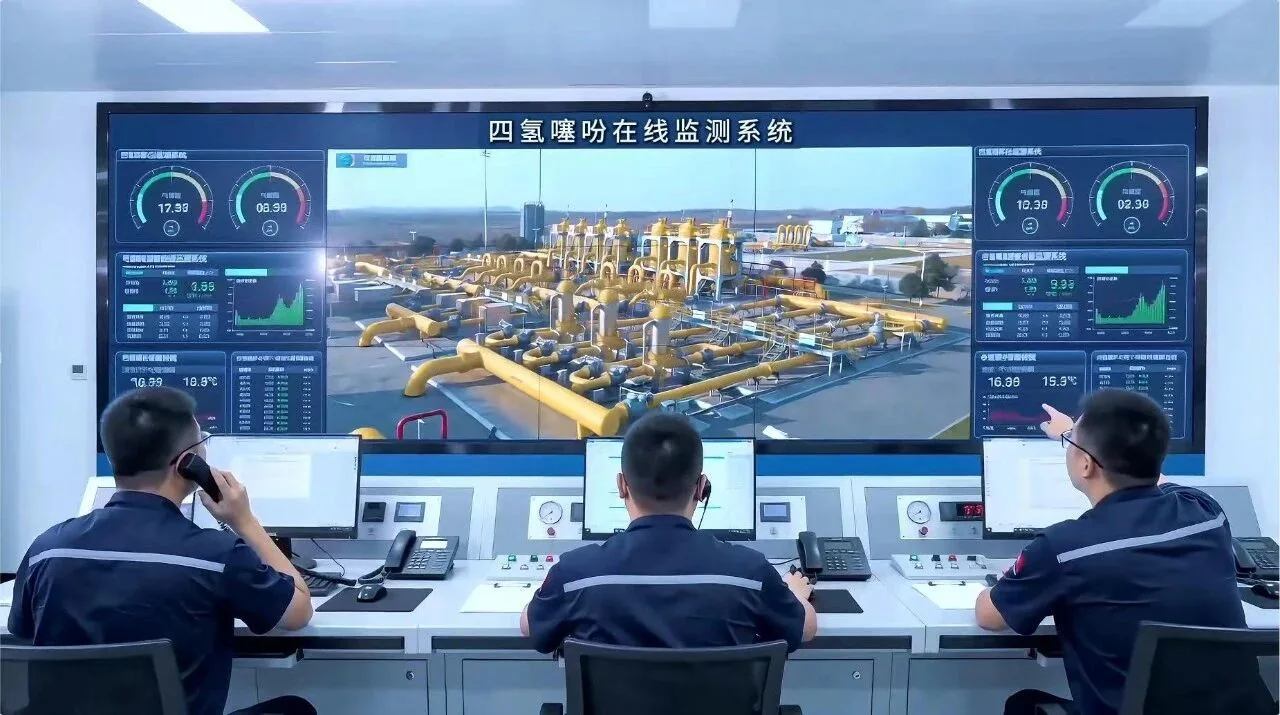 Operators viewing a THT monitoring system in a gas-station control room